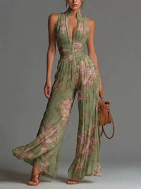 White sleeveless chiffon jumpsuit with V-neck, zipper, and wide pleated pants